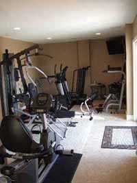basement workout room with flooring