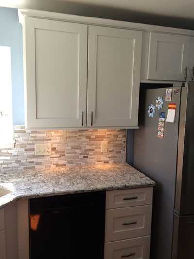 white kitchen cabinets with granite