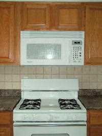 New microwave and cooktop in new kitchen