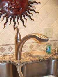 installation and plumbing of kitchen faucet and sink