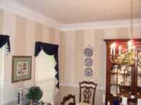 striped painting on wall with trim.