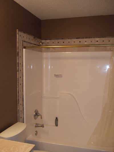 Heartland Remodeling Llc Quality Tile, How To Trim Around A Bathtub Surround